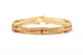 Appraisal: AN KARAT THREE-STRAND BRACELET WITH RUBIES Herringbone patterned three strand