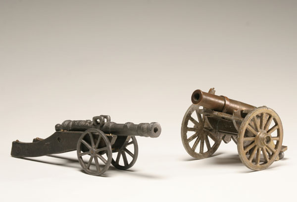 Appraisal: Two toy cannons brass field artillery piece mounted on wooden