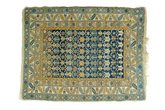 Appraisal: ORIENTAL RUG Kuba Multiple borders Shades of blue ivory and