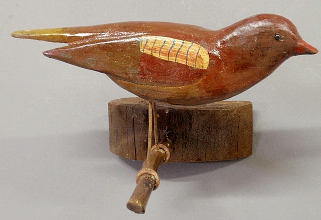 Appraisal: - Hanging folk art carved and paint decorated bird late