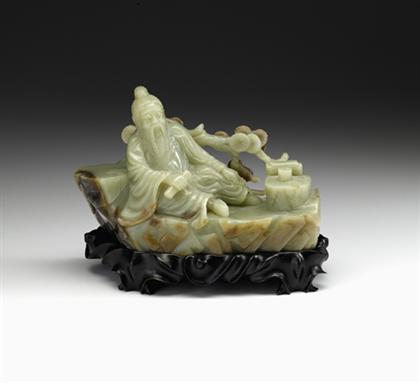 Appraisal: Large Chinese celadon and brown jade figural grouping on stand