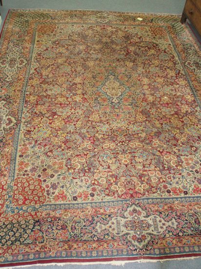 Appraisal: A Kirman carpet S E Persia bordered and figured approximately