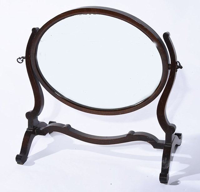 Appraisal: A MAHOGANY SWING OVAL TOILET MIRROR cm