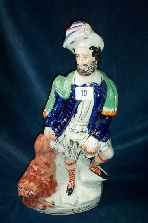 Appraisal: A th century Staffordshire figure of a kilted male figure