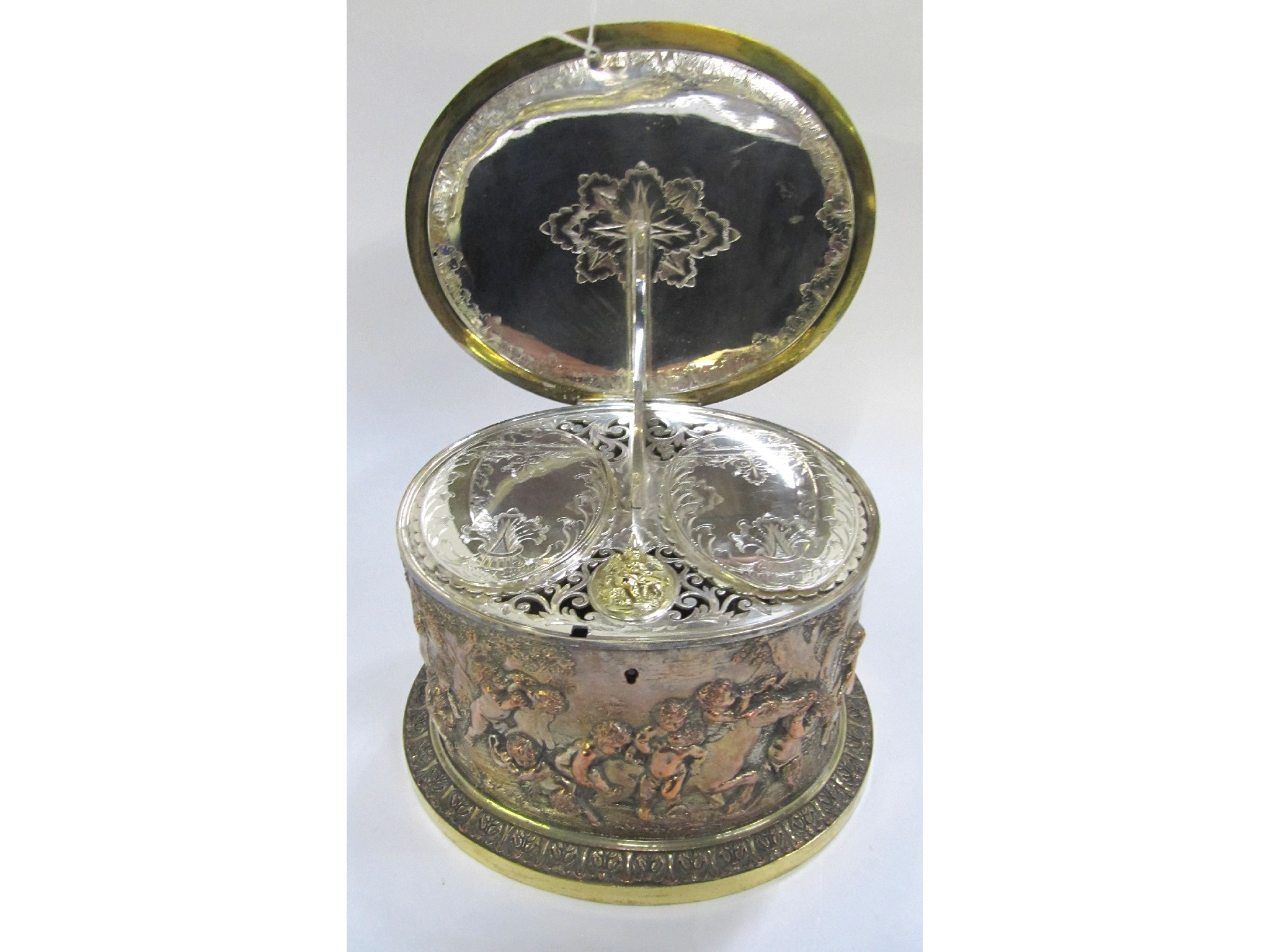 Appraisal: An embossed silver plated biscuit barrel with fitted interior