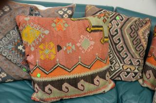 Appraisal: Eight throw pillows three needlepoint and five Kilim flatweave rug