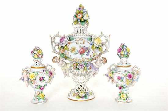 Appraisal: German porcelain garniture early th century Rococo inspired floral-encrusted and