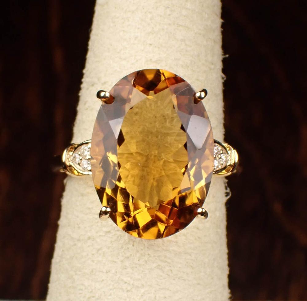 Appraisal: CITRINE DIAMOND AND FOURTEEN KARAT GOLD RING The yellow gold