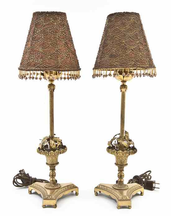 Appraisal: A Pair of Gilt Bronze Table Lamps each cast with