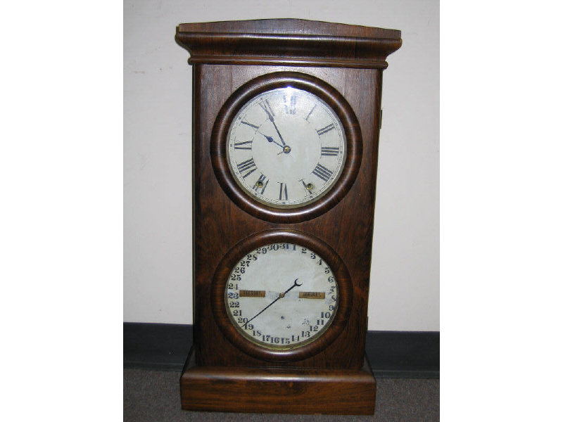 Appraisal: SETH THOMAS PARLOR CALENDAR CLOCK The ogee crest above the