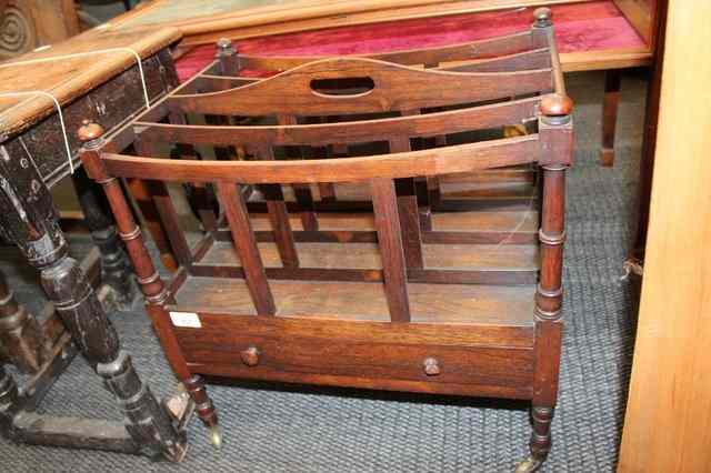 Appraisal: A VICTORIAN ROSEWOOD CANTERBURY with mushroom shaped finials to the