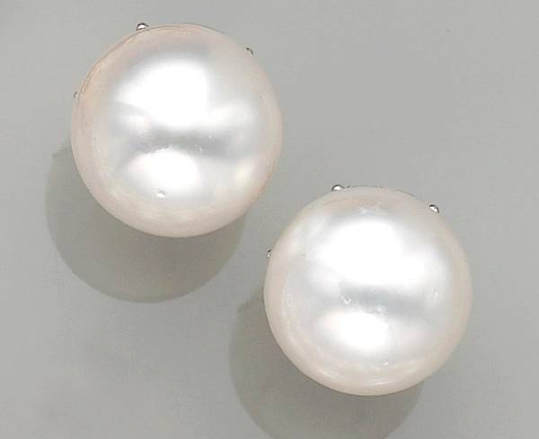 Appraisal: each earclip with a round South Sea cultured pearl measuring