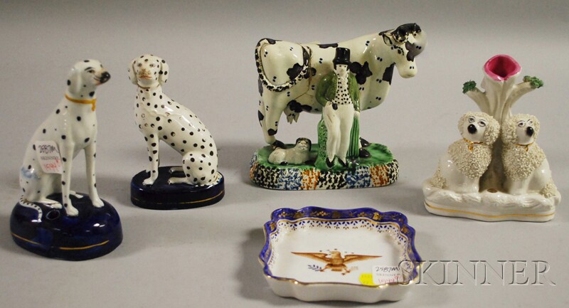 Appraisal: Three Staffordshire Dog Figures and a Cow and Peasant Figural