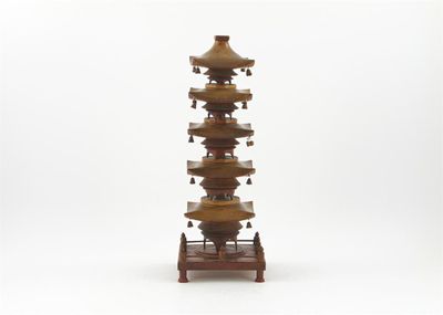 Appraisal: A carved wooden model of a pagoda missing finial