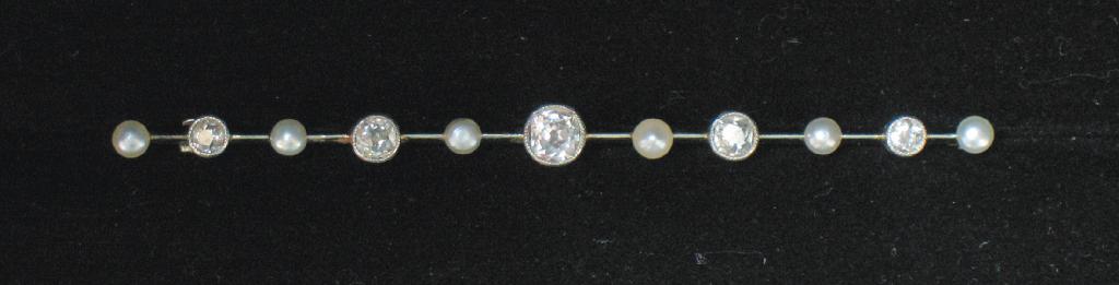 Appraisal: A DIAMOND AND PEARL BAR BROOCH the five round old-cut