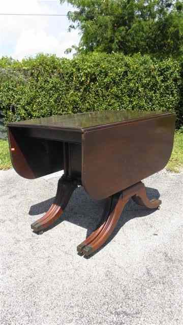 Appraisal: Brandt drop leaf table with sabre legs Two leaves on