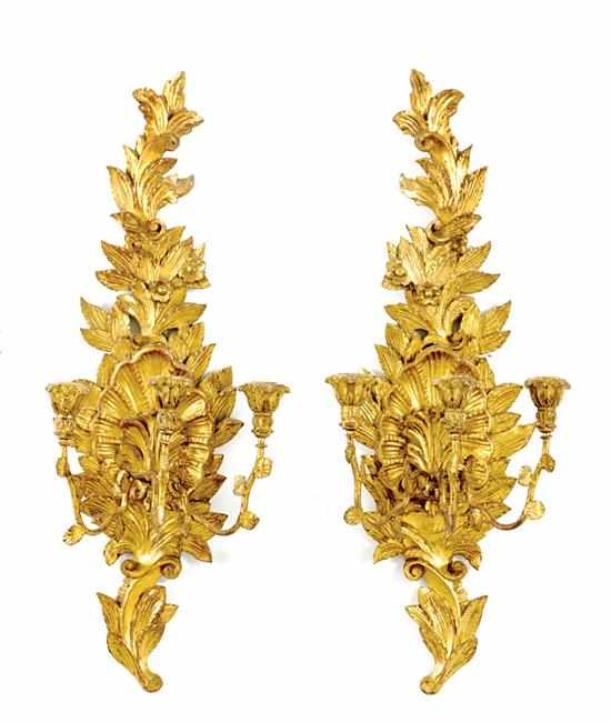 Appraisal: Pair carved giltwood and metal three-light sconces circa scrolling acanthus