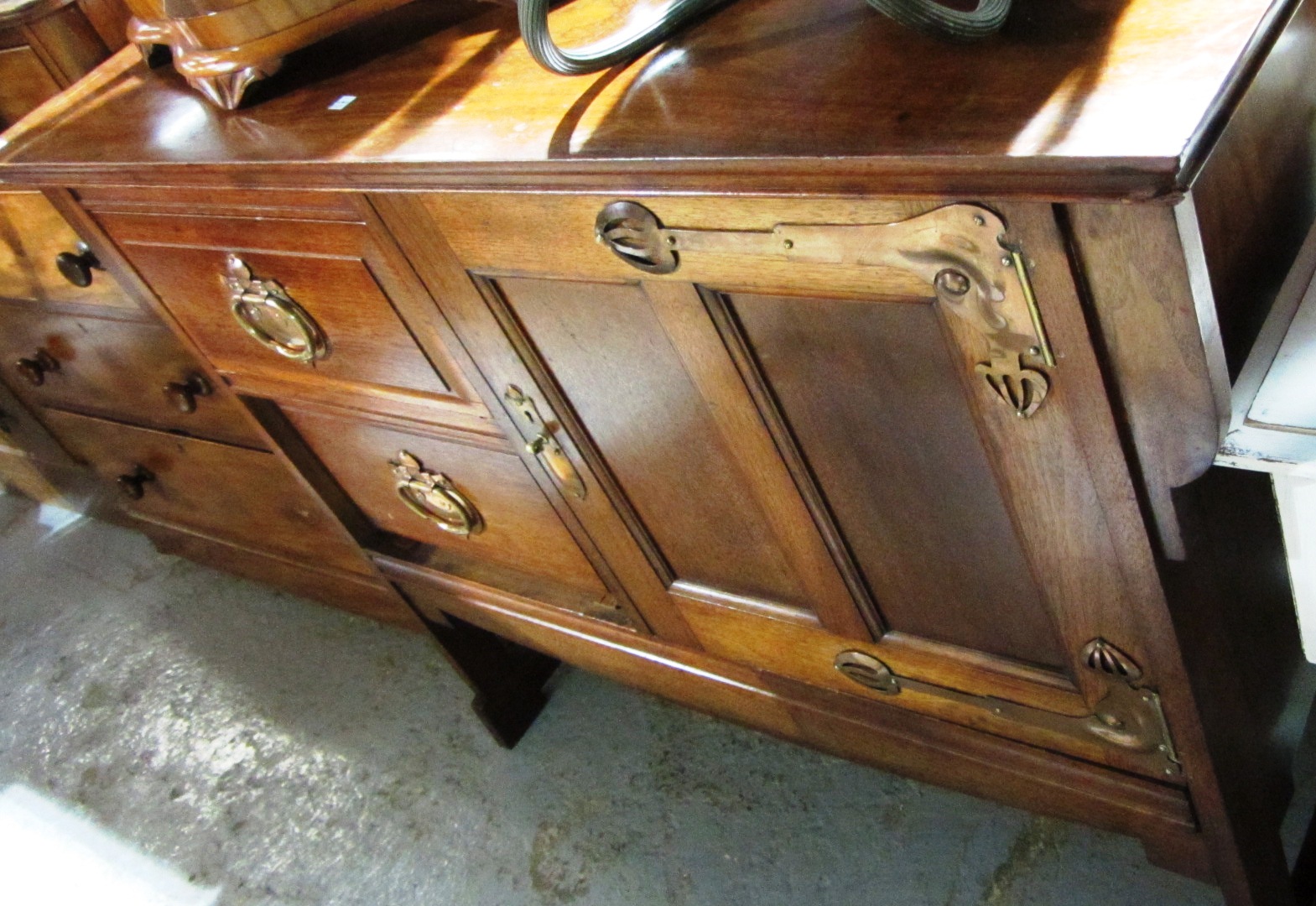 Appraisal: A mahogany Arts Crafts style sideboard with copper handles