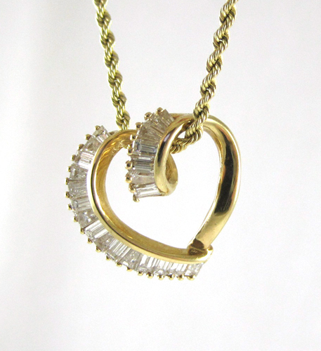 Appraisal: DIAMOND AND FOURTEEN KARAT GOLD PENDANT NECKLACE with certificate The