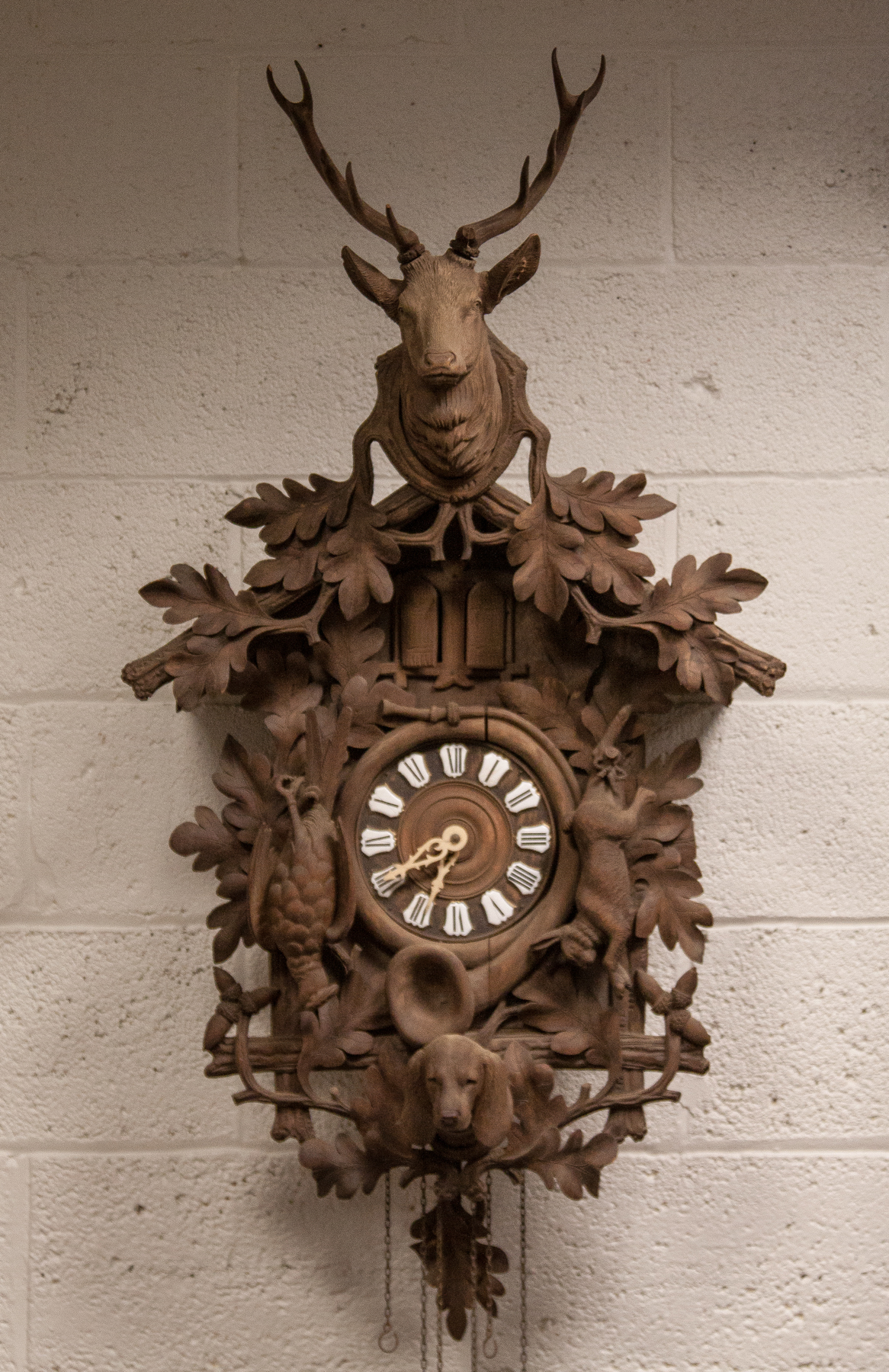 Appraisal: Black Forest Carved Cuckoo Clock th cent With rabbit pheasant