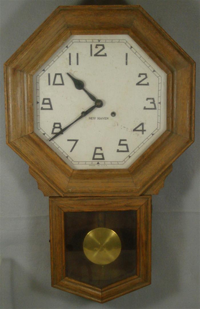 Appraisal: New Haven octagon oak schoolhouse clock T S runs strikes