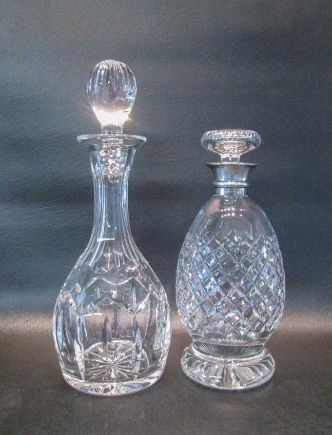 Appraisal: TWO CUT CRYSTAL DECANTERS each clear cut crystal unsigned one