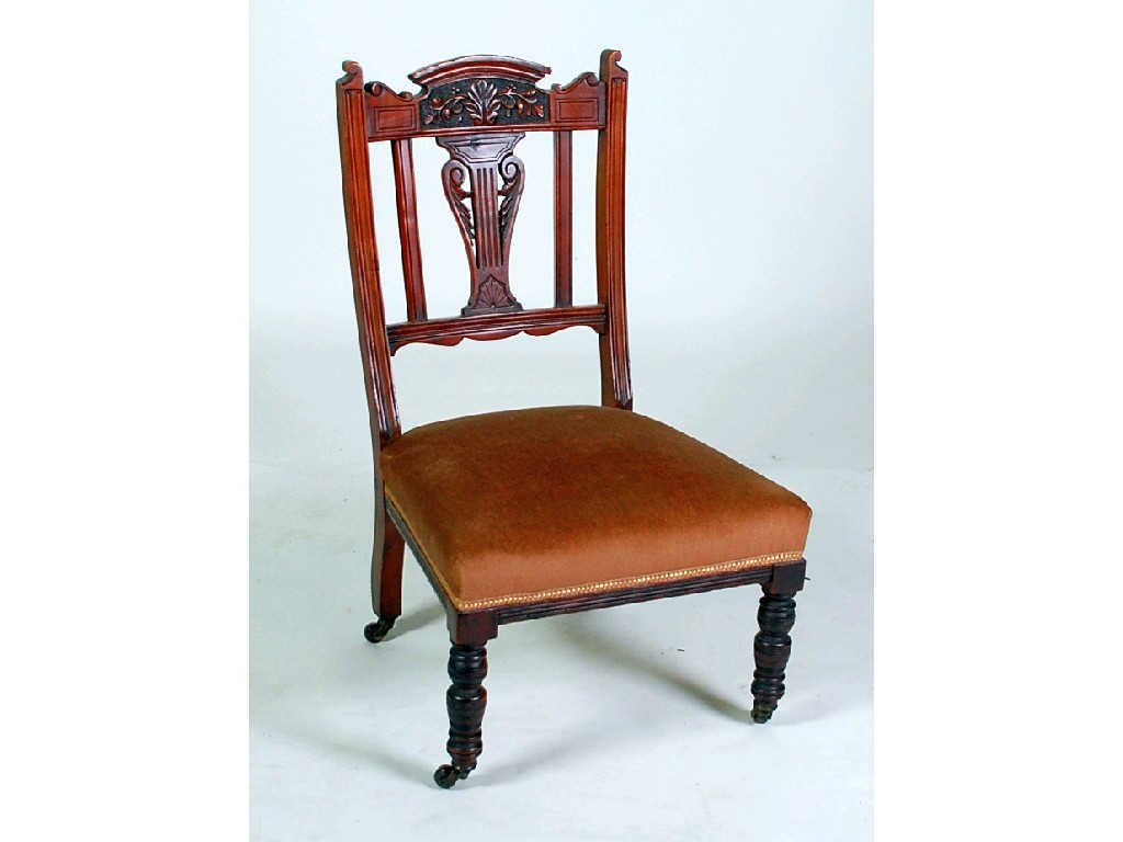 Appraisal: VICTORIAN CARVED WALNUTWOOD NURSING CHAIR the arched top rail with