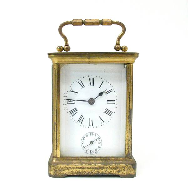 Appraisal: A French brass carriage timepiece in a corniche case with