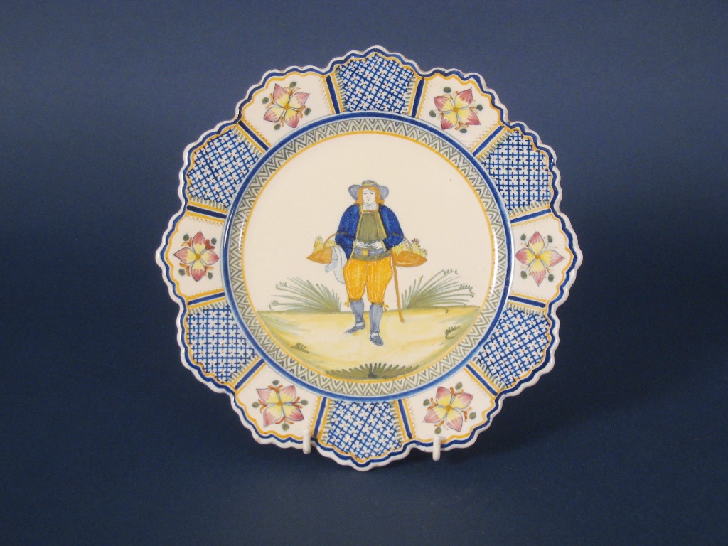 Appraisal: A Quimper polychrome Plate painted peasant with baskets of chickens