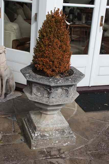 Appraisal: A PAIR OF HADDONSTONE GOTHIC STYLE PLANTERS and conforming supports