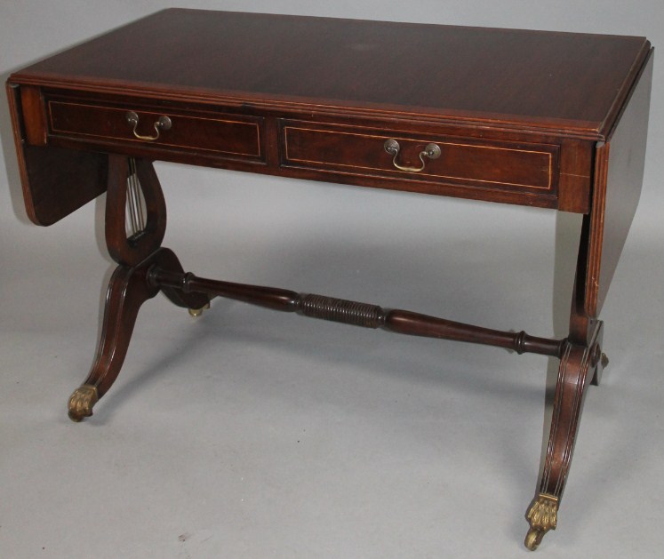 Appraisal: A thC mahogany sofa table the top with a wide