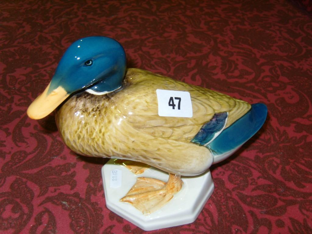 Appraisal: A Beswick model of a mallard raised on an octagonal