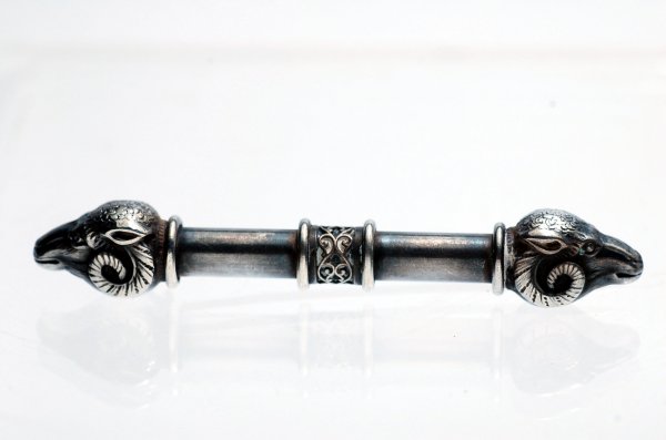 Appraisal: Egyptian Revival Victorian silver bar pin center cylindrical scrolled decoration