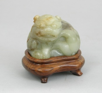 Appraisal: A Jade Carving of a Lion Chinese A carved jade