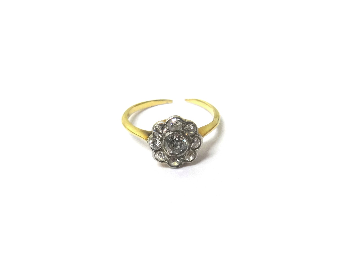 Appraisal: A gold and diamond set nine stone cluster ring collet