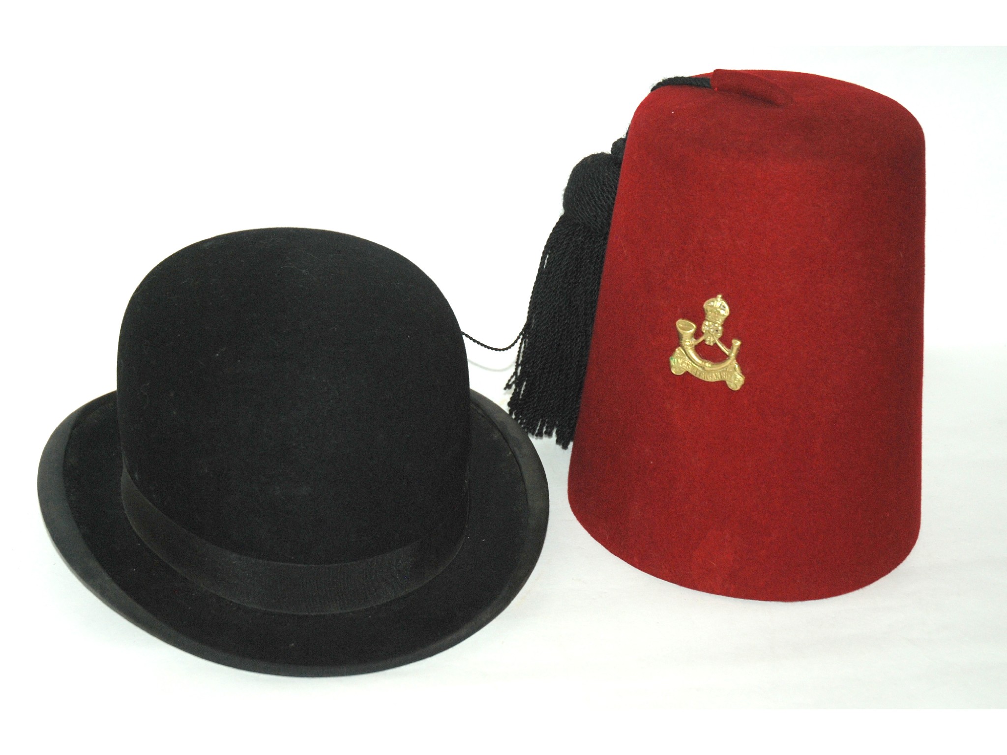 Appraisal: Three various military hats two with cap badges a fez