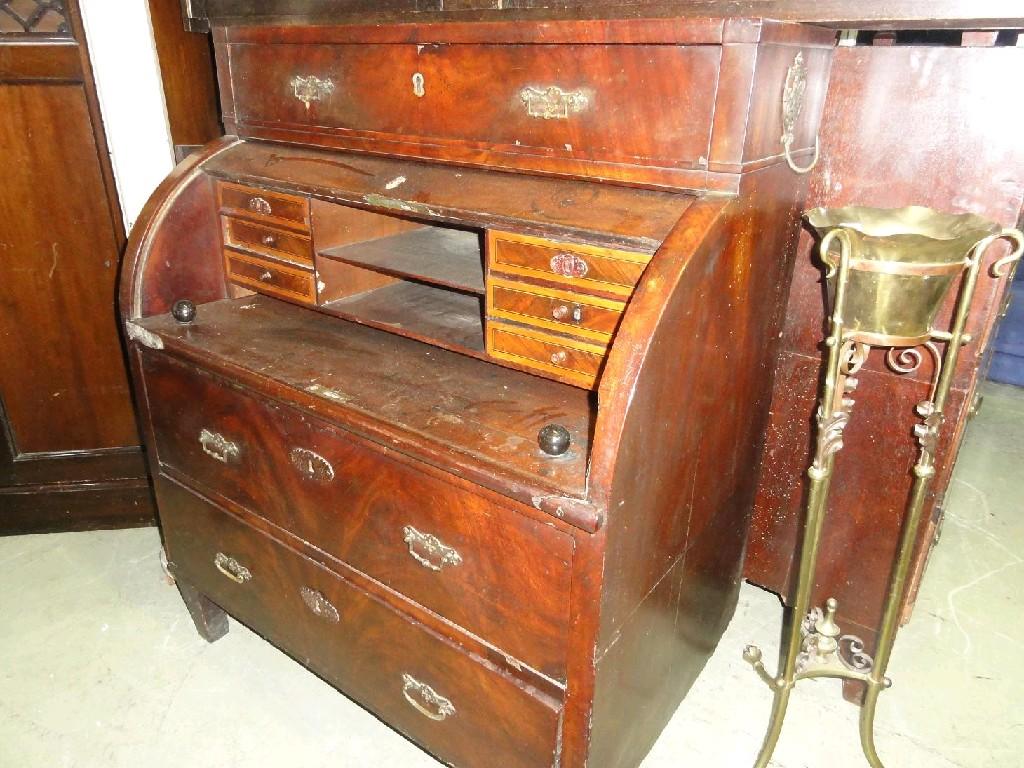 Appraisal: A th century continental mahogany bureau the cylinder front enclosing