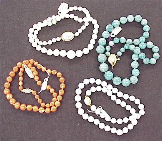 Appraisal: JEWELRY Four stands of beads strand of nephrite beads with