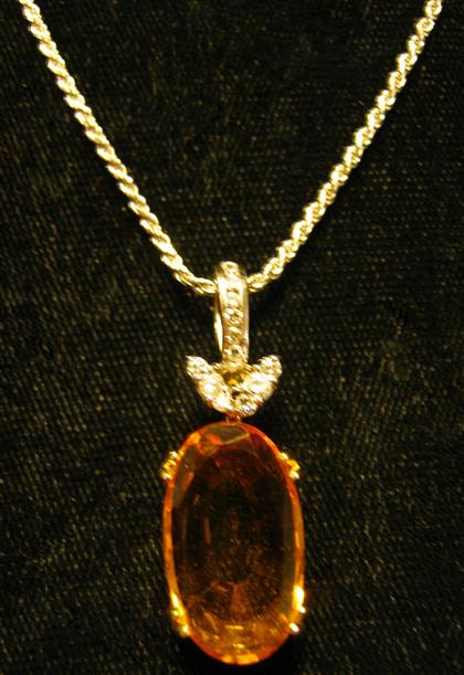 Appraisal: karat white gold citrine and diamond pendantOblong citrine prong set