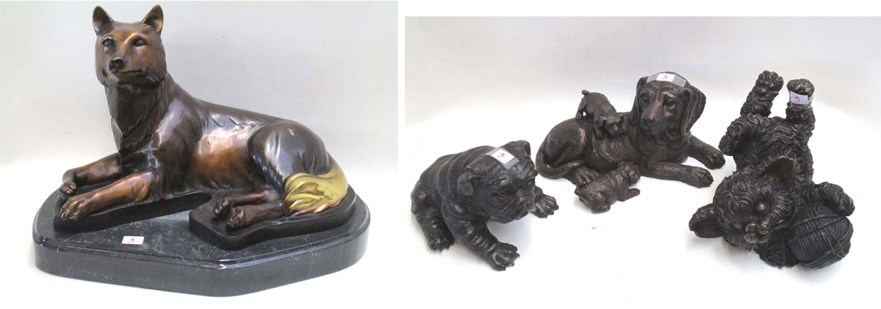 Appraisal: FOUR BRONZE ANIMAL SCULPTURES of dogs puppies and a kitten