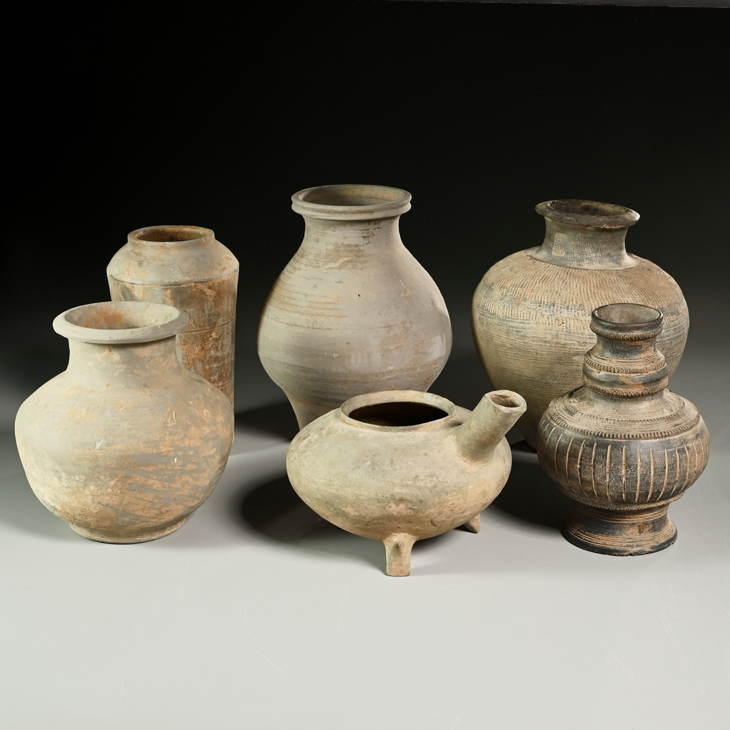 Appraisal: CHINESE AND KOREAN GREY POTTERY VESSELS Silla Dynasty and Warring