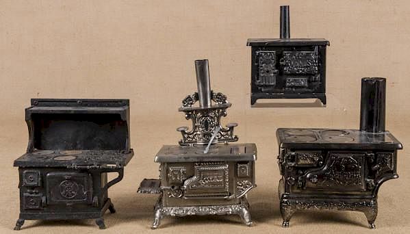 Appraisal: Four cast iron and nickel toys stoves to include Four