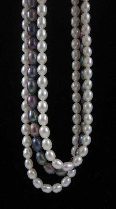 Appraisal: TRIPLE STRAND BLACK AND WHITE PEARL NECKLACE with two strands