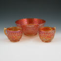 Appraisal: Carnival glass grape vine bowl with two matching cups Unmarked