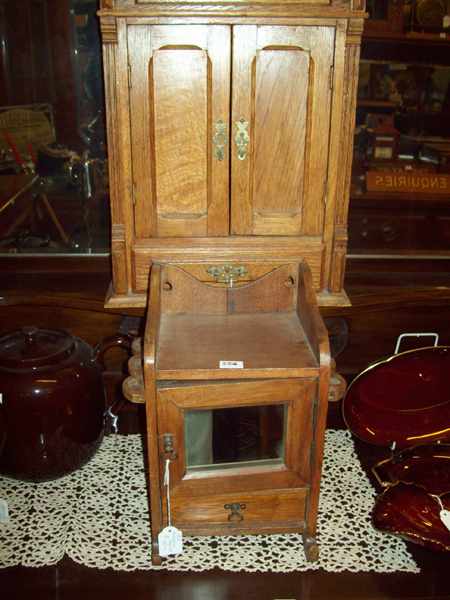 Appraisal: A LATE VICTORIAN PIPE HOLDER AND A MINIATURE OAK WARDROBE