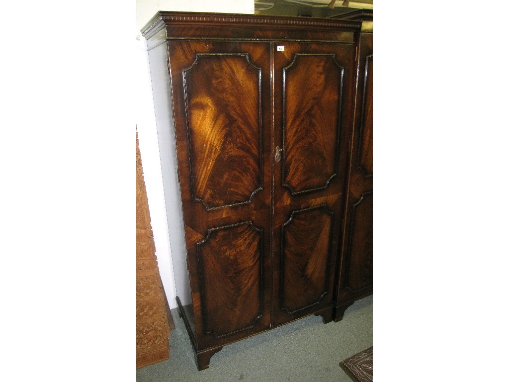 Appraisal: Ladies and gents mahogany panel door wardrobes