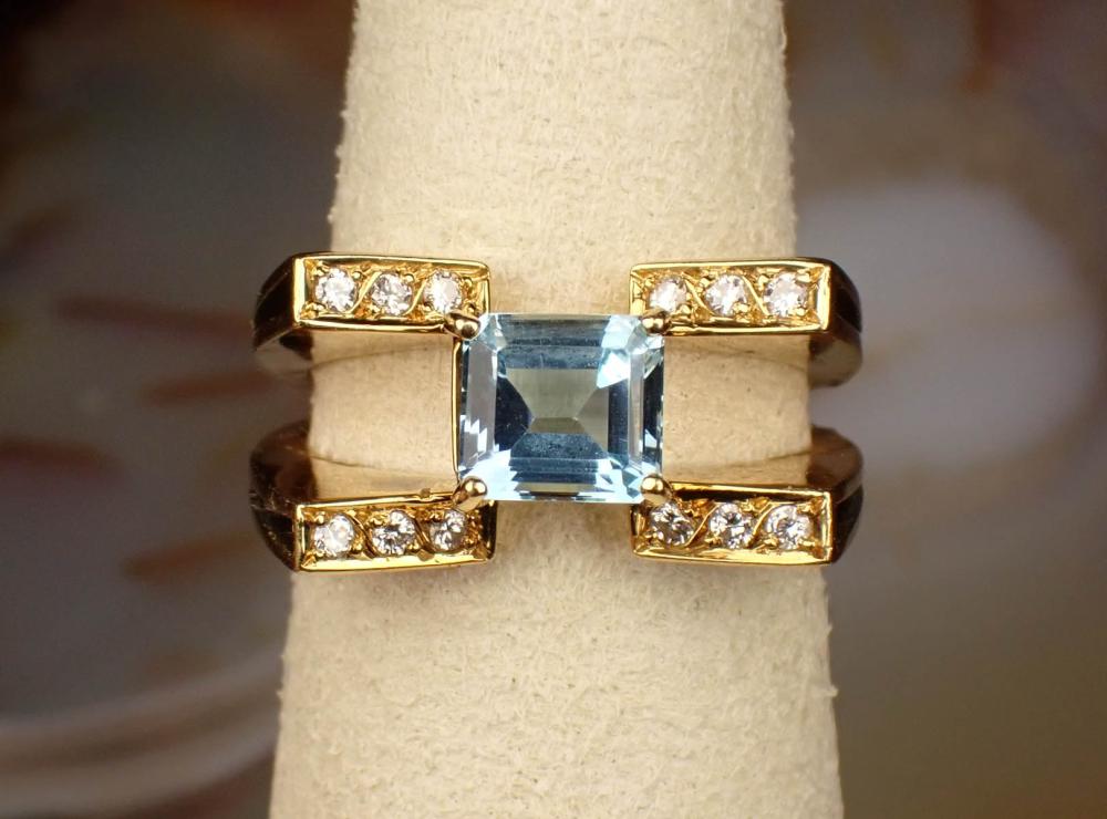 Appraisal: AQUAMARINE DIAMOND AND EIGHTEEN KARAT GOLD RING The yellow gold