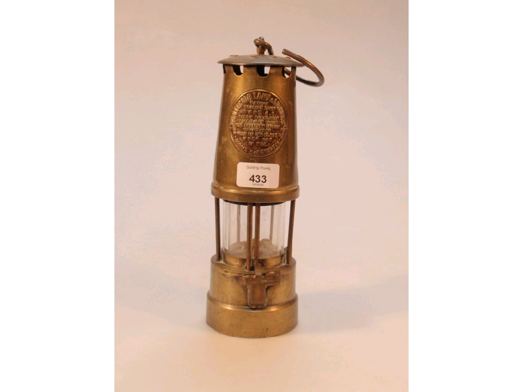 Appraisal: A brass miners lamp by the Protector Lamp Lighting Co