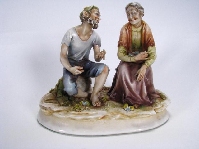 Appraisal: Antonio Borsato Sailor and Old Lady x porcelain figural grouping