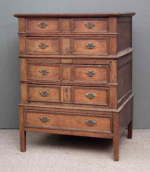 Appraisal: A th Century panelled oak chest on later stand the